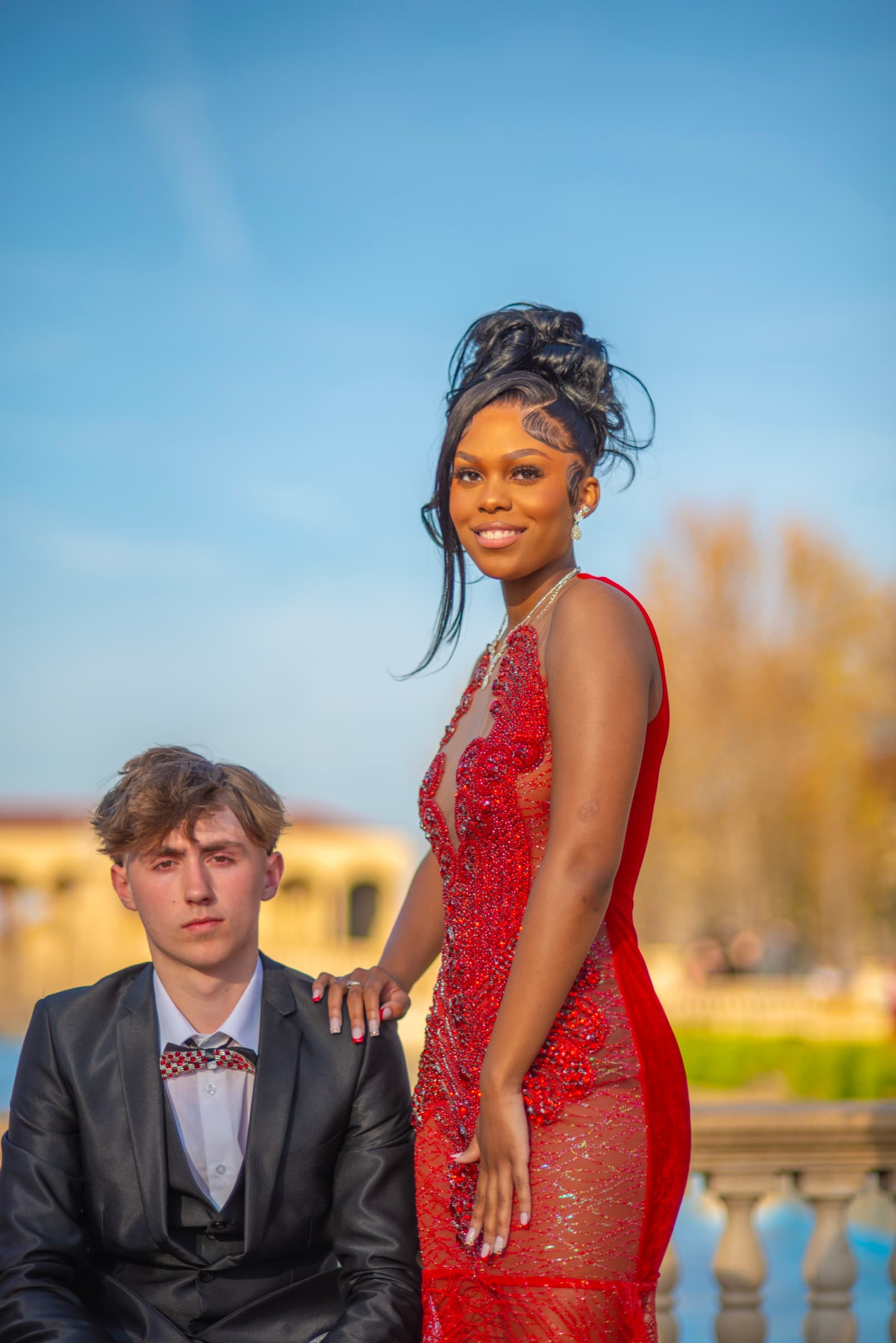 Senior portrait session with balustrade backdrop